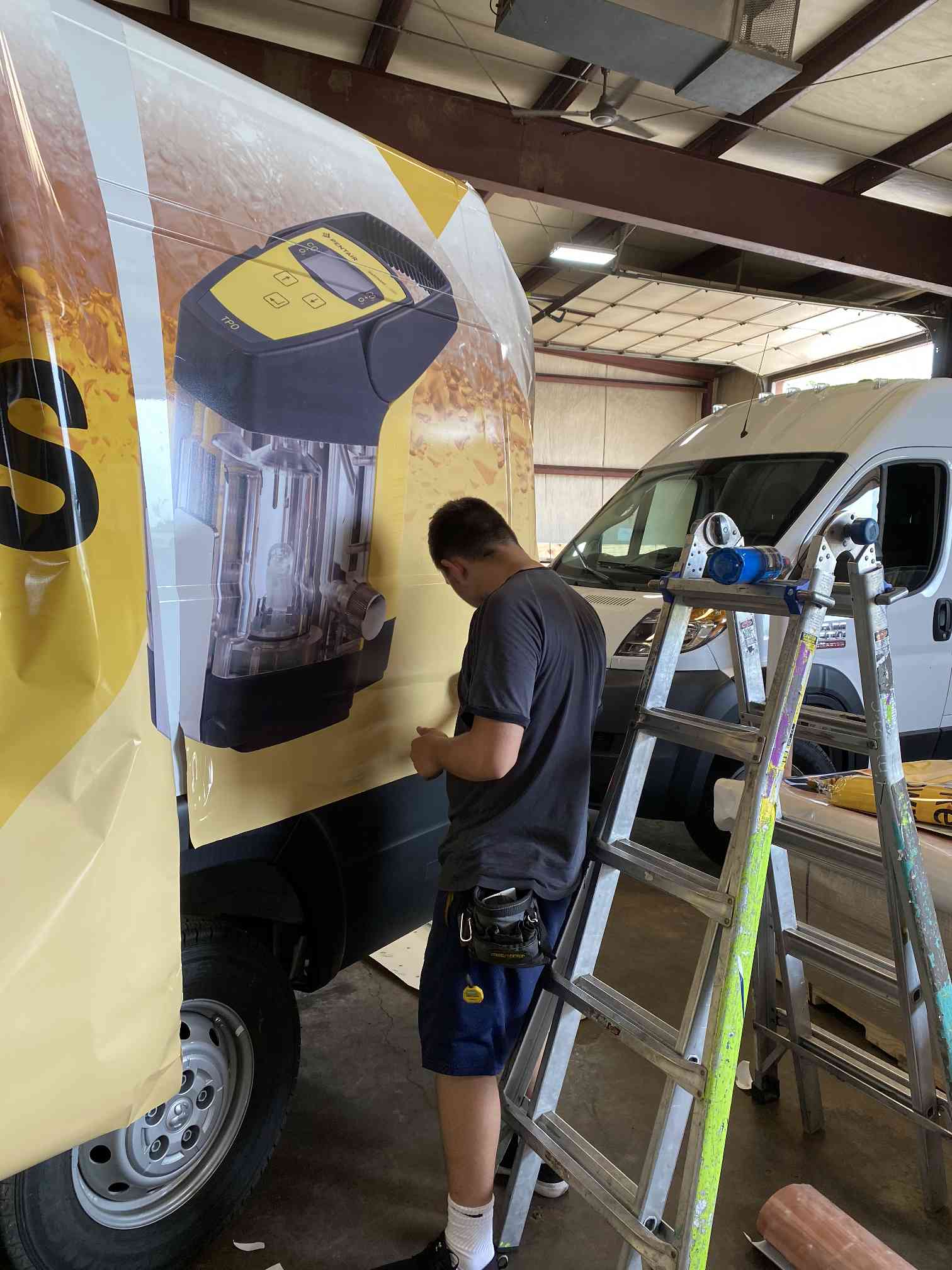 Professional graphics installer at work